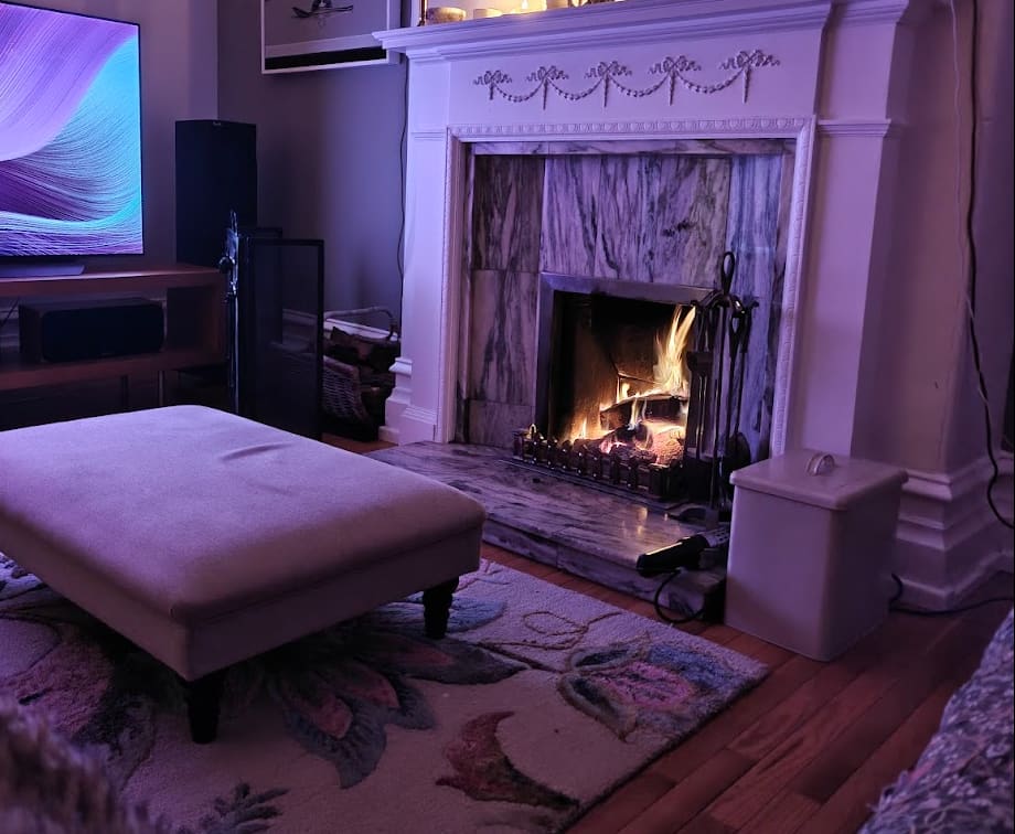 Cosy living room with open fire burning